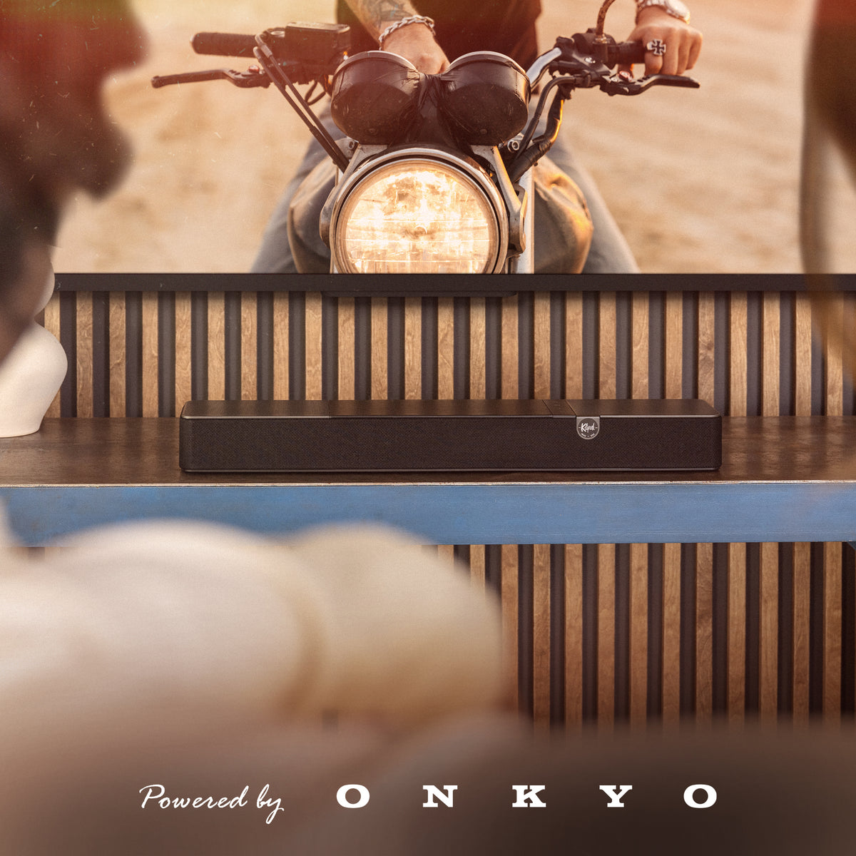 Klipsch Flexus Core 100 Soundbar NA Walnut Klipsch Flexus CORE 100 WN with motorcycle on tv with PBO logo