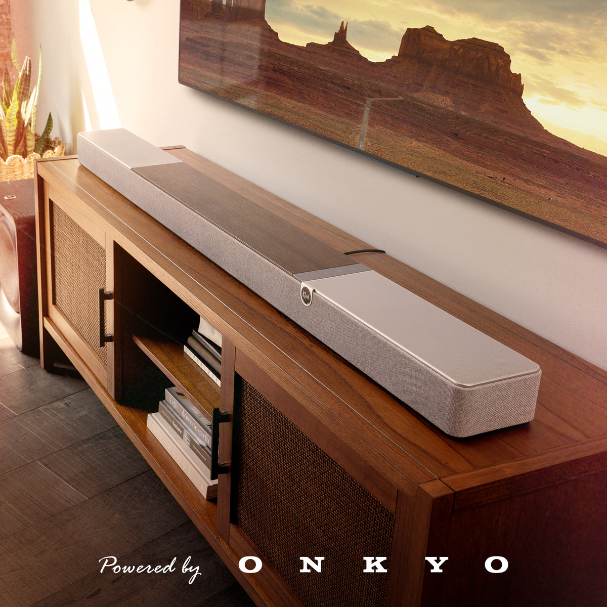 Klipsch Flexus Core 300 Soundbar NA Walnut Flexus CORE 300 WN on media console with beautiful southwestern American landscape on tv