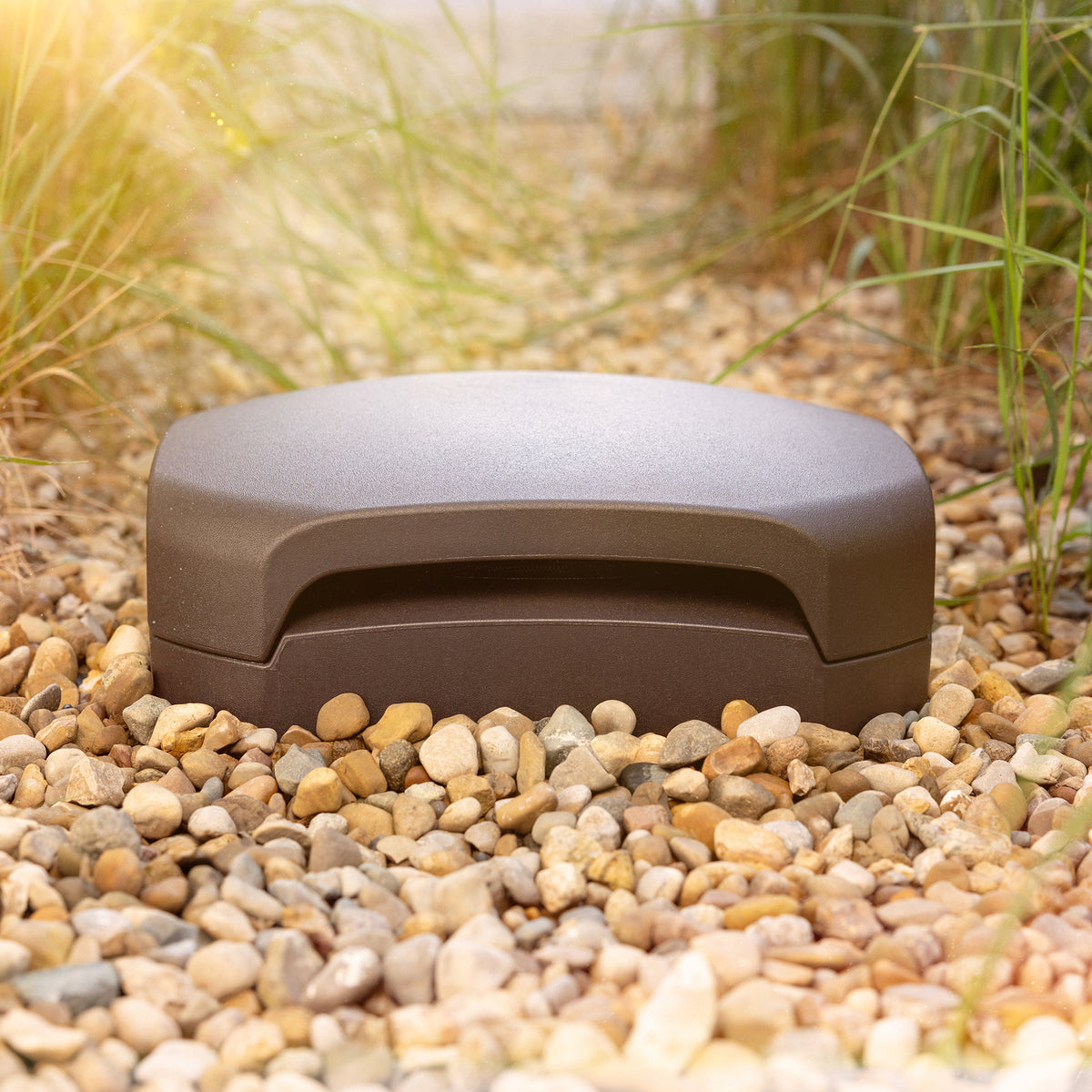 Klipsch Klipsch Courtyard 4.1 Black Klipsch Courtyard Subwoofer outside buried in patio gravel at golden hour 2000x2000