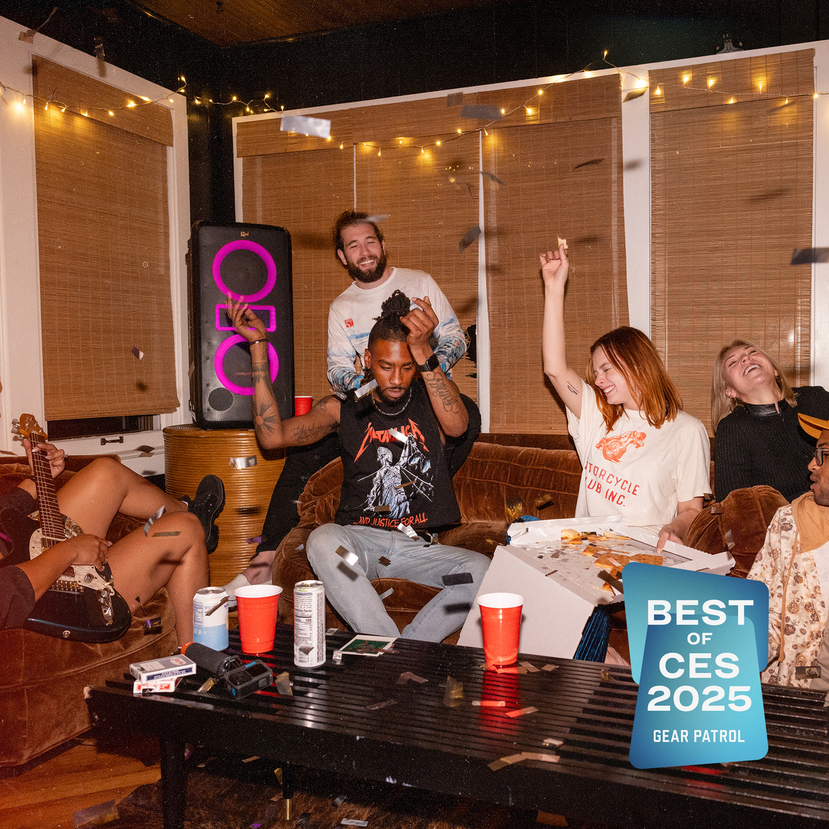 Klipsch Klipsch New York NA Black (Led Accents) Klipsch New York Party Speaker in apartment party with friends grooving and silver confetti falling and pizza and beverages on table with Gear Patrol Best of CES 2025 badge 2000x2000