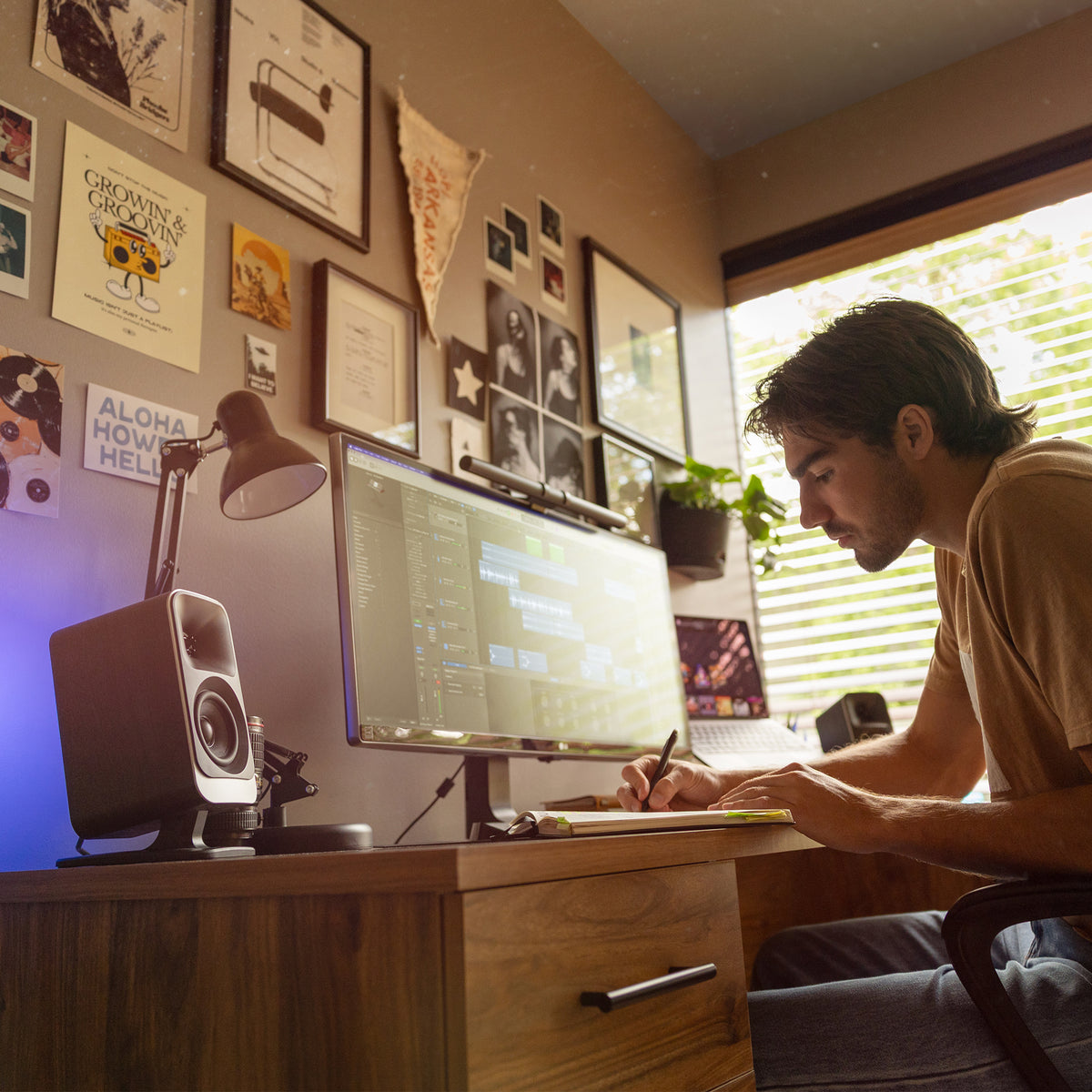 Klipsch ProMedia Lumina 2.1 NA Black (Led Accents) Klipsch Promedia Lumina on Desktop with Man Working 2000x2000