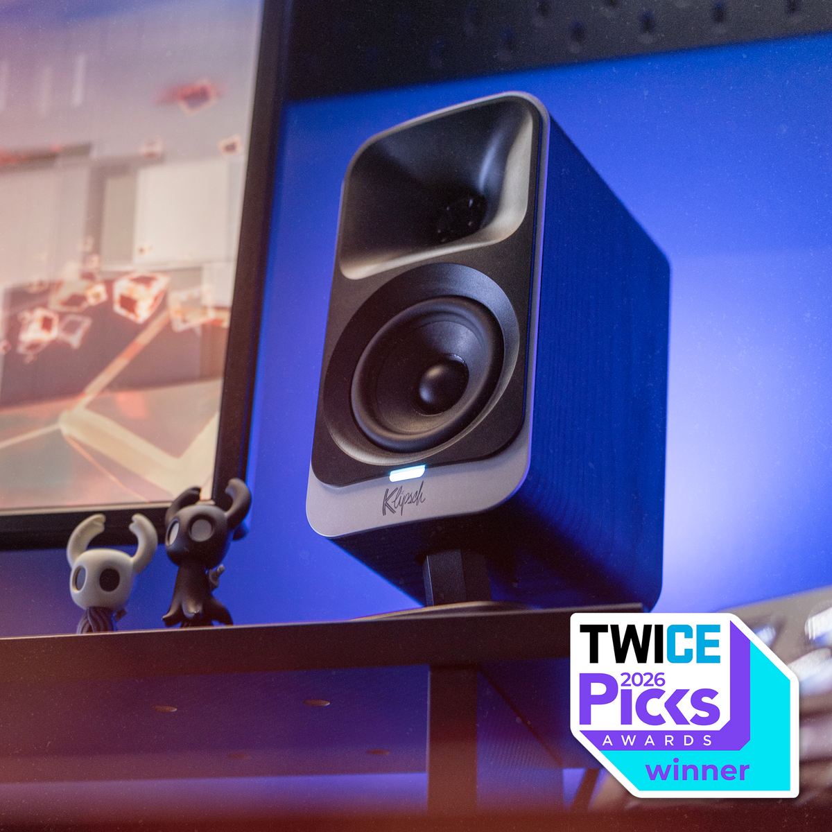 Klipsch ProMedia Lumina 2.1 NA Black (Led Accents) Klipsch Promedia Lumina on desktop wth indigo LED lighting and figurines with TWICE Picks 2026 badge