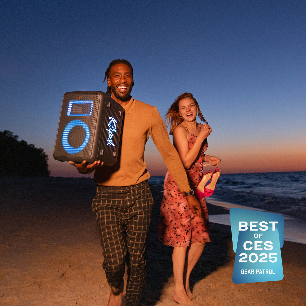 Klipsch Klipsch Vegas NA Black (Led Accents) Klipsch Vegas Party Speaker held by man running on beach with friend laughing with Gear Patrol Best of CES 2025 badge 2000x2000