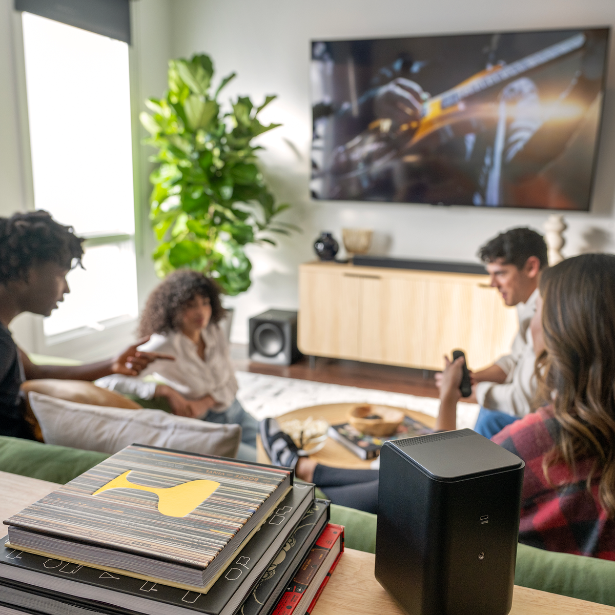 Klipsch Flexus Surrounds NA Black Klipsch Flexus SURR 100 behind friends hanging out